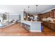 Open concept kitchen featuring a breakfast bar, granite countertops, and stainless steel appliances at 6084 Queens River Dr, Mableton, GA 30126