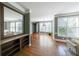 Bright and airy living room with hardwood floors, large windows, and stylish decor at 6084 Queens River Dr, Mableton, GA 30126