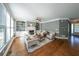 Cozy living room with fireplace, built-in shelving, and large windows provides ample natural light at 6084 Queens River Dr, Mableton, GA 30126