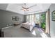 Serene main bedroom with a tray ceiling, neutral walls, and plush carpeting at 6084 Queens River Dr, Mableton, GA 30126