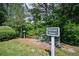 Enjoy a scenic nature trail with lush greenery, a wooden bridge, and serene surroundings at 6084 Queens River Dr, Mableton, GA 30126