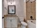 Bathroom featuring granite countertops, shower and bathtub combo at 9270 Colham Dr, Cumming, GA 30041