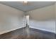 Empty bedroom featuring dark wood flooring and ample space at 9270 Colham Dr, Cumming, GA 30041