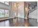Elegant foyer features soaring ceilings, decorative molding and gleaming hardwood floors at 9270 Colham Dr, Cumming, GA 30041