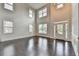 Elegant foyer features soaring ceilings, decorative molding and gleaming hardwood floors at 9270 Colham Dr, Cumming, GA 30041