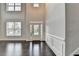 Elegant foyer features soaring ceilings, decorative molding and gleaming hardwood floors at 9270 Colham Dr, Cumming, GA 30041