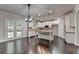 Bright open kitchen boasts a large island, granite countertops, and modern appliances at 9270 Colham Dr, Cumming, GA 30041