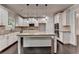 Beautiful kitchen featuring white cabinets, granite countertops, and stainless steel appliances at 9270 Colham Dr, Cumming, GA 30041