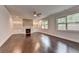 Spacious living room features a stone fireplace, built-in bookshelves, and ample natural light at 9270 Colham Dr, Cumming, GA 30041