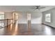 Upstairs loft area featuring hardwood floors, neutral paint, and a ceiling fan at 9270 Colham Dr, Cumming, GA 30041