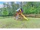 Backyard playground surrounded by lush greenery at 9270 Colham Dr, Cumming, GA 30041