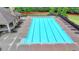 A pristine community pool with ample lounge seating and a covered pavilion, perfect for relaxation and summer fun at 9270 Colham Dr, Cumming, GA 30041