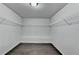 Walk-in closet with installed shelving at 9270 Colham Dr, Cumming, GA 30041