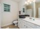 Bathroom with a bright white vanity, single sink and neutral tiling on the floor at 2623 Grapevine Cir # 602, Cumming, GA 30041