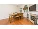 Bright dining room featuring hardwood floors, a fireplace, and backyard views at 2623 Grapevine Cir # 602, Cumming, GA 30041
