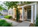Welcoming front porch with elegant columns, manicured bushes and a covered entrance at 2623 Grapevine Cir # 602, Cumming, GA 30041