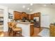 Kitchen with breakfast bar seating, stainless steel appliances, and wooden cabinetry with lots of storage at 2623 Grapevine Cir # 602, Cumming, GA 30041