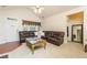 Bright living area boasts vaulted ceilings, neutral carpet, and a comfortable leather sofa at 2623 Grapevine Cir # 602, Cumming, GA 30041