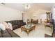 Cozy living room features vaulted ceiling, plush carpeting and comfortable seating arrangement at 2623 Grapevine Cir # 602, Cumming, GA 30041