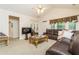 Spacious living room features high ceilings, a cozy sectional, and ample natural light at 2623 Grapevine Cir # 602, Cumming, GA 30041