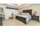 Spacious main bedroom with tray ceilings and decorative blue valances at 2623 Grapevine Cir # 602, Cumming, GA 30041