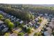 Charming home in a lush, tree-lined neighborhood with a well-maintained lawn and a driveway at 312 Burdock Trce, Woodstock, GA 30188