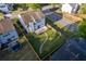 Aerial view showcasing a home with a fenced backyard, a patio, and lush green grass at 312 Burdock Trce, Woodstock, GA 30188