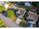 Aerial view shows a home with a manicured lawn, charming front porch, and private driveway at 312 Burdock Trce, Woodstock, GA 30188