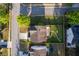 Aerial view showcasing a home with a well-kept backyard, a paved patio, and mature trees at 312 Burdock Trce, Woodstock, GA 30188