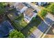 Aerial view of a two-story home featuring a fenced backyard with patio and mature trees at 312 Burdock Trce, Woodstock, GA 30188