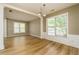 Spacious dining room with hardwood floors and large windows providing natural light at 312 Burdock Trce, Woodstock, GA 30188