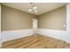 Elegant dining room with hardwood floors, chandelier, and wainscoting at 312 Burdock Trce, Woodstock, GA 30188
