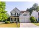 Charming two-story home with landscaped yard and two-car garage at 312 Burdock Trce, Woodstock, GA 30188