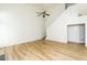 Vaulted ceiling in a spacious living room with a ceiling fan and hardwood floors at 312 Burdock Trce, Woodstock, GA 30188