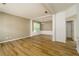 Open-concept living room with hardwood floors and plenty of natural light at 312 Burdock Trce, Woodstock, GA 30188