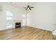 Bright living room with a fireplace, high ceiling and hardwood floors at 312 Burdock Trce, Woodstock, GA 30188
