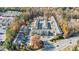 Overhead view of a meticulously designed townhome community with tree-lined streets, ample parking, and convenient access at 5260 Cresslyn Rdg, Alpharetta, GA 30005