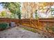 Private backyard featuring a wooden fence, small patio, and mature landscaping, providing a relaxing outdoor retreat at 5260 Cresslyn Rdg, Alpharetta, GA 30005