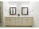 Bright bathroom with double vanity, framed mirrors, and walk-in shower at 5260 Cresslyn Rdg, Alpharetta, GA 30005