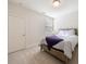 Bedroom with neutral carpet, queen bed, natural light from window and closet at 5260 Cresslyn Rdg, Alpharetta, GA 30005
