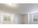 Bright room with large windows, modern recessed lighting, and neutral carpet at 5260 Cresslyn Rdg, Alpharetta, GA 30005