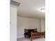 Simple bedroom with a wooden bed frame, carpeted floor, and modern lighting at 5260 Cresslyn Rdg, Alpharetta, GA 30005