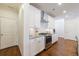 Gourmet kitchen features stainless steel appliances, granite countertops, and ample cabinet space at 5260 Cresslyn Rdg, Alpharetta, GA 30005