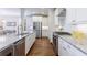 Gourmet kitchen with granite countertops, stainless steel appliances, and hardwood flooring at 5260 Cresslyn Rdg, Alpharetta, GA 30005