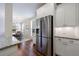 Bright kitchen features stainless steel appliances, granite countertops, and hardwood floors at 5260 Cresslyn Rdg, Alpharetta, GA 30005
