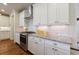 Kitchen featuring stainless steel oven, granite countertops and white cabinetry at 5260 Cresslyn Rdg, Alpharetta, GA 30005