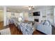 Bright living room featuring built-in shelving, a fireplace and hardwood floors at 5260 Cresslyn Rdg, Alpharetta, GA 30005