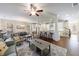 Open-concept living room and kitchen boasts hardwood floors, granite counters and abundant natural light at 5260 Cresslyn Rdg, Alpharetta, GA 30005