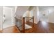 Staircase with wooden banister and hardwood floors connecting multiple levels at 5260 Cresslyn Rdg, Alpharetta, GA 30005