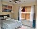 Charming bedroom with a comfortable bed, ocean-themed artwork, and a unique floor lamp at 1218 Matt Moore Ct, Lithia Springs, GA 30122